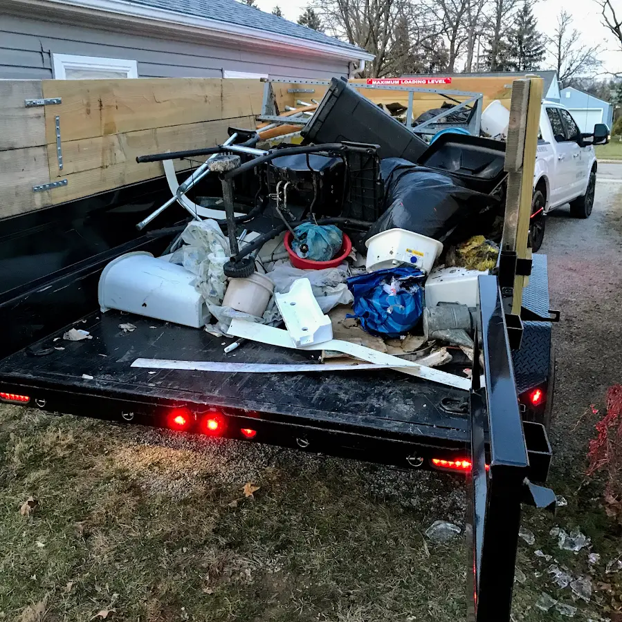 Roll-off dumpster delivered to a residential driveway in Cuba